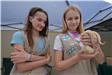 Girl Scouts holding reptiles